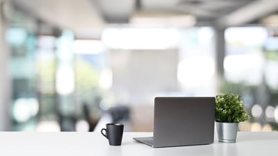 workspace-laptop-computer-coffee-cup-with-plant-pot-office-table